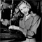 Veronica Lake: By Government request, she puts up her long hair as a safety measure